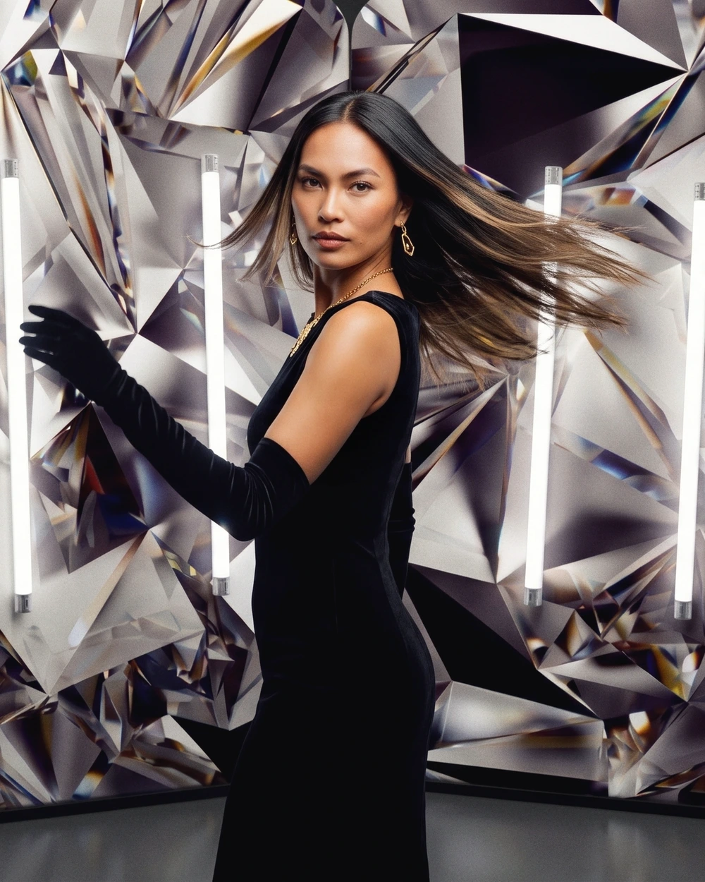 Dazzle Booth — a subject posing under professional studio lighting for a slow-motion cinematic clip.